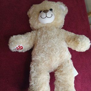 Cream-Colored Build a Bear B.A.B on paw